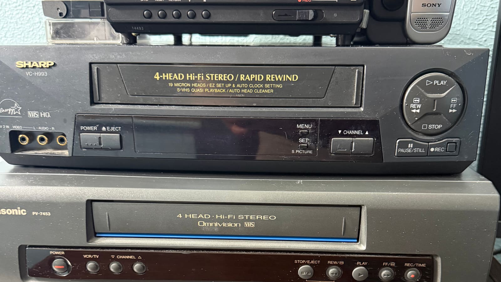 The Attic Lab capture rig in Pittsburgh: stacked 4-head Hi-Fi VCRs, a Video8 deck, and a Hi8 camcorder used for tape digitization